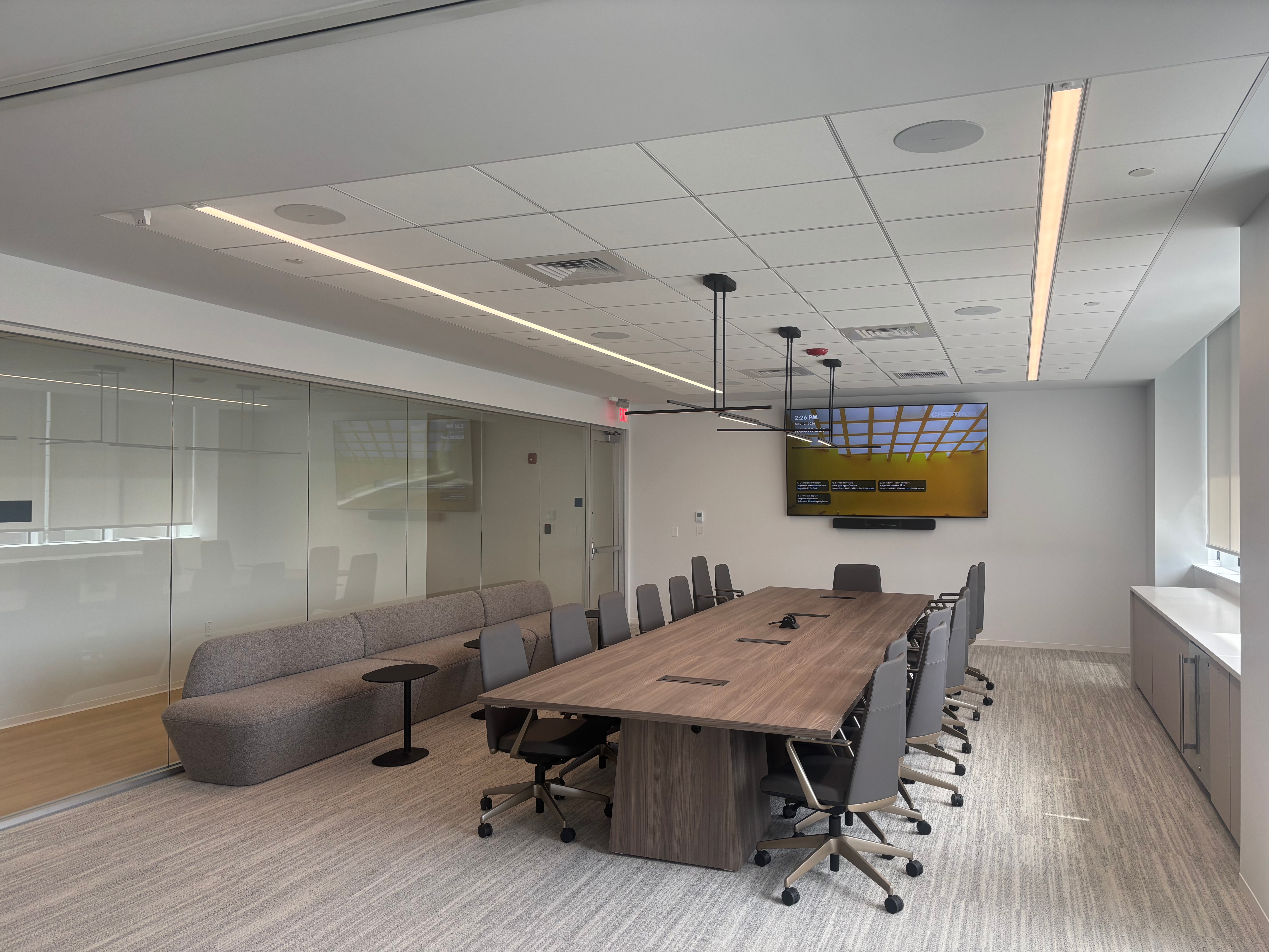 Conference room with projector screen and integrated AV setup
